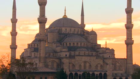 the blue mosque in istanbul turkey in red orange sunset light