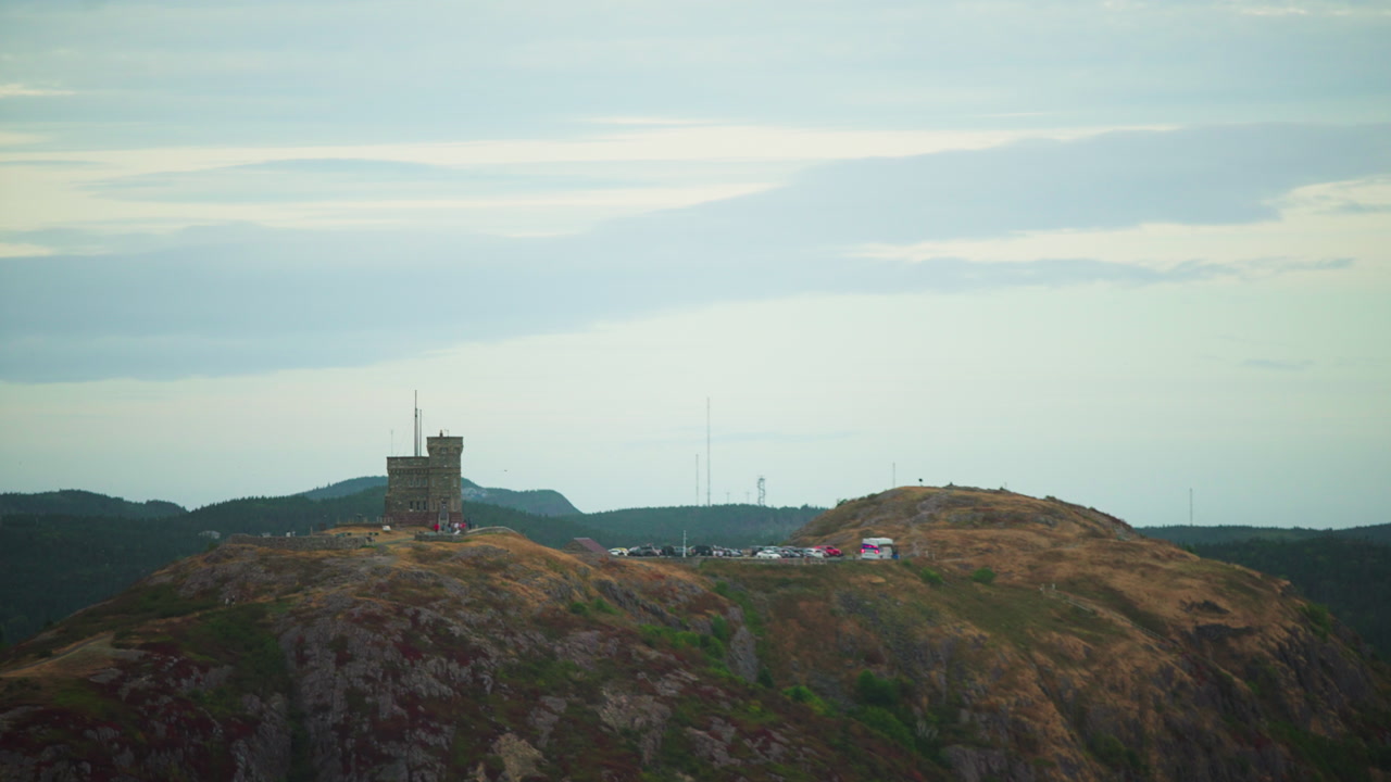 Aerial shot overlooking castle on edge of cliff during a cloudy fall day. Signal Hill. St. Johns, Newfoundland Canada.
