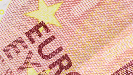 Zehn-Euro-Schein-Oberflächendetail-Gedruckter-Buchstaben,-Rotierend,-Makroaufnahme