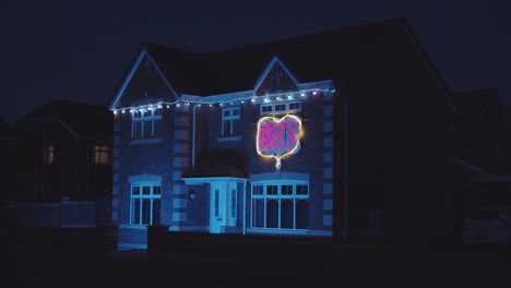 thank you nhs, house decorated with illuminated sign at night appreciating the work of the nhs uk england during lockdown
