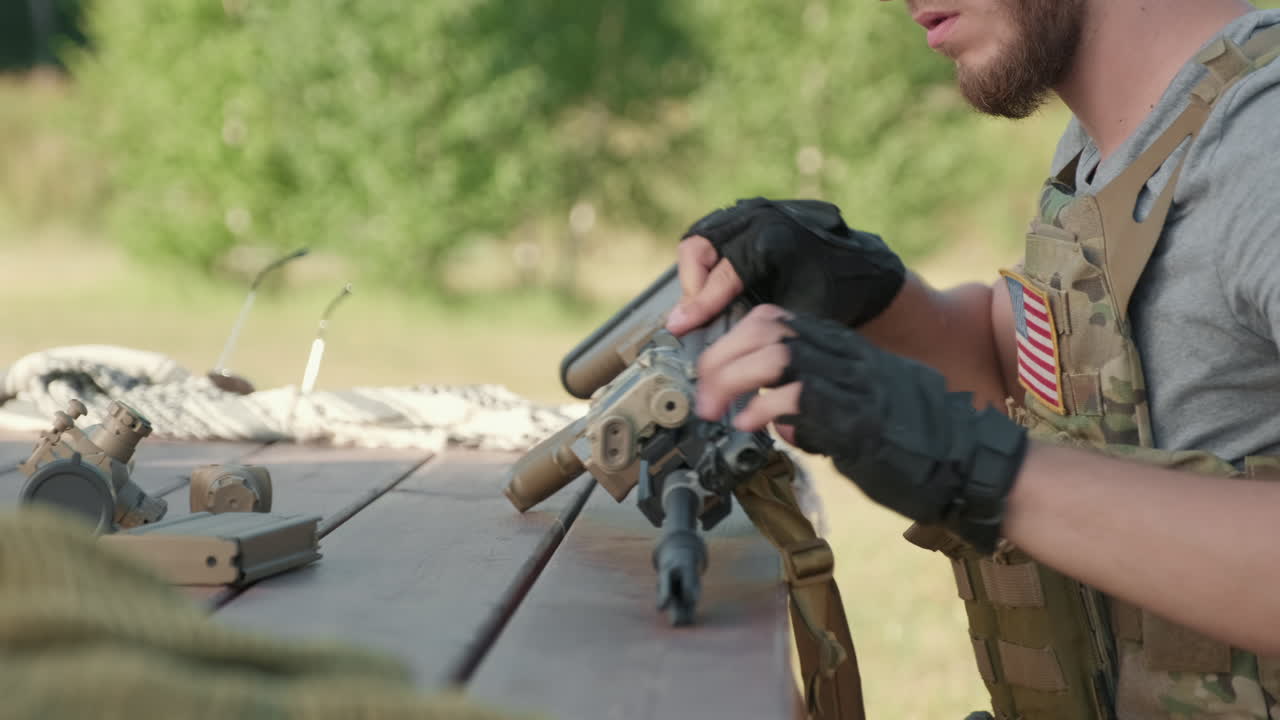 US Soldier Dismantling Rifle