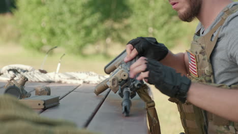 us soldier dismantling rifle