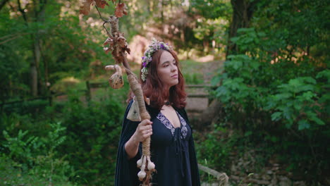 young-druid-girl-in-a-forest-contemplating-the-view-medium-shot