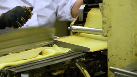 a woman works at a pancake machine