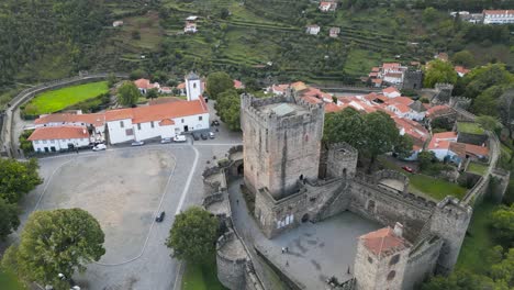 drone push in to tower of medieval castle in historic center of braganza portugal