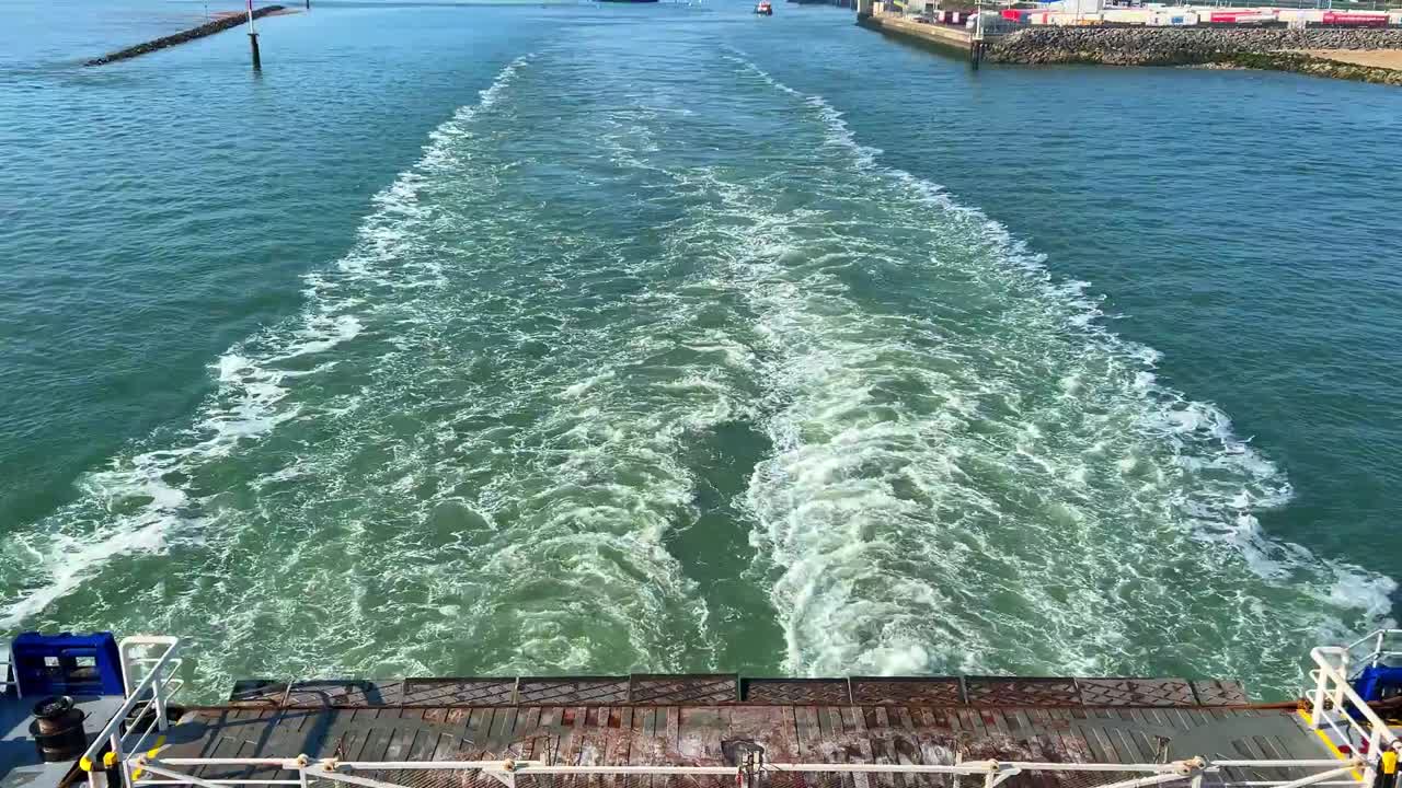 Wake behind a ferry leaving the harbour.