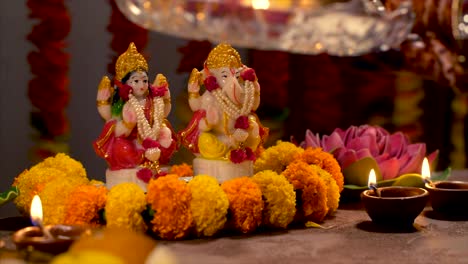 woman performing goddess laxmi aarti on the occasion of diwali