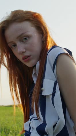 red-haired woman in a field