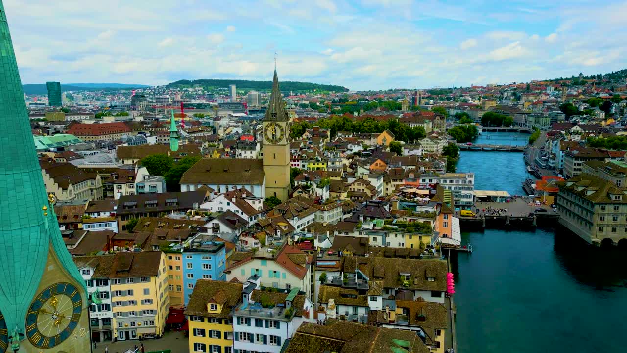 4K Drone Video of the Historic Fraumünster and St. Peter Churches on the banks of the Limmat River in Downtown Zurich, Switzerland