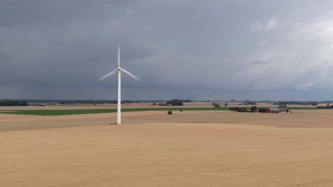 pull in drone shot showing dramatic scene with dark clouds of vast swedish countryside