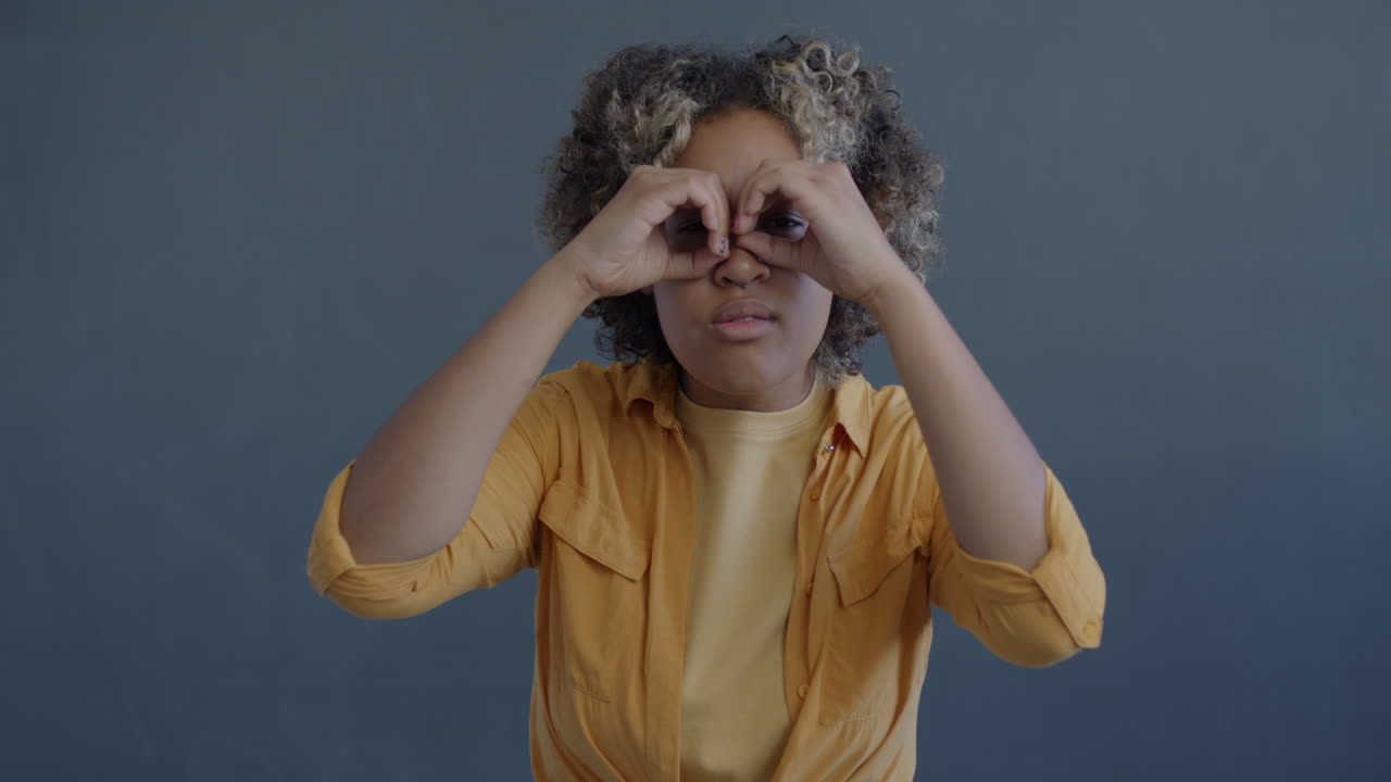 Woman Playing with Hands in Front of Face