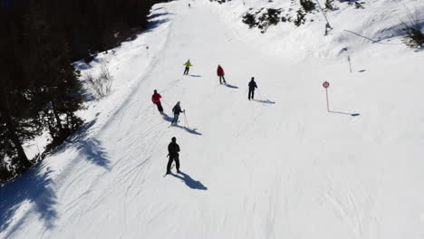 people skiing on a downhill track. outdoors exercise