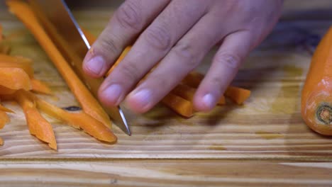 cutting carrot into julienne on wooden board kitchen healthy healthy diet