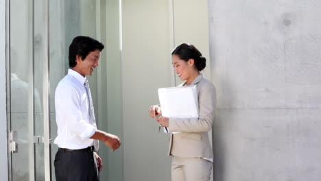 estate agent giving house key to buyer