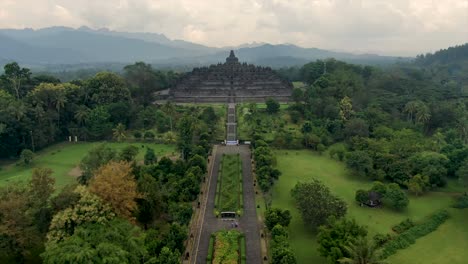 empty iconic buddhist temple borobudur java indonesia aerial dolly on cloudy day