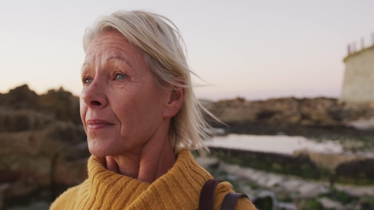 Side view of senior woman at beach