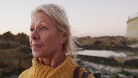 Side-view-of-senior-woman-at-beach