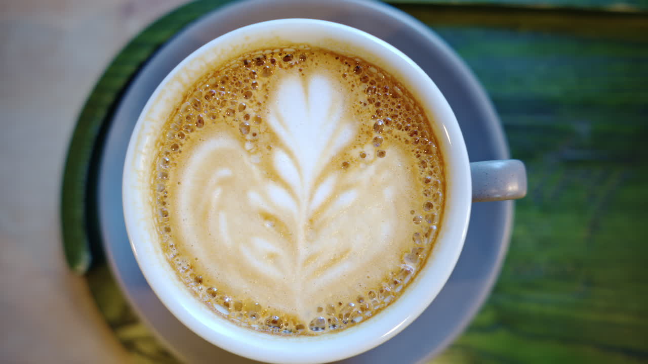 Top down shot of foam latte art on coffee