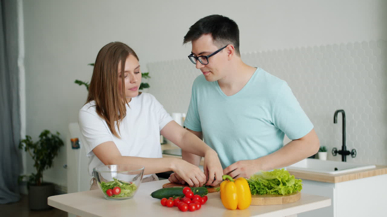 Couple preparing a healthy vegetable salad