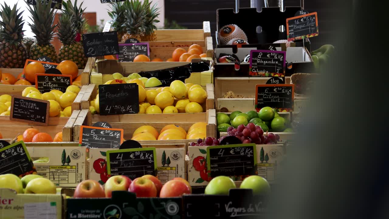 People Passing By Fruit Stand At Food Market In Antibes, France. static shot