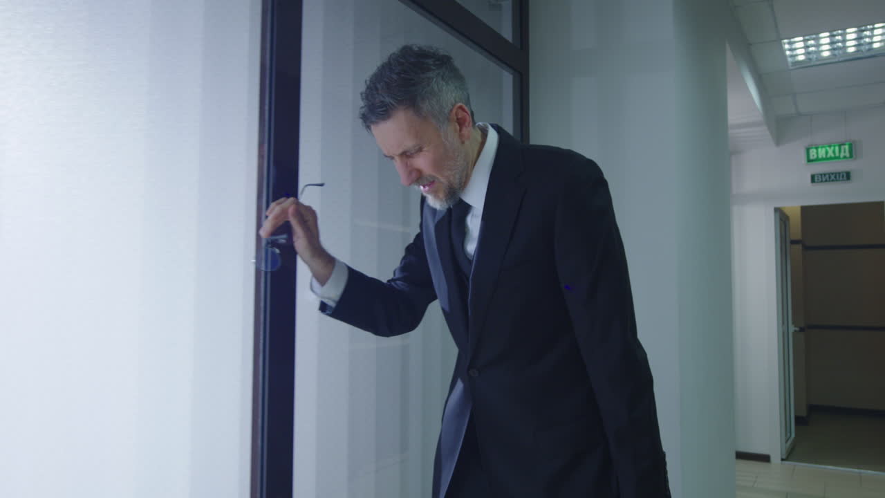 Man in Suit in Office Hallway