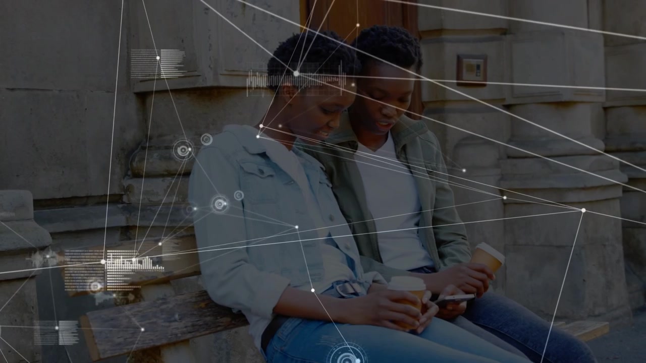 Animation of connections over happy african american female friends with smartphones