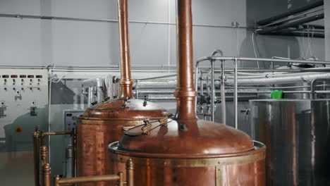 copper brewing tanks in a brewery