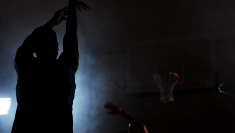 sportsmen playing basketball