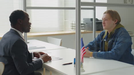 business interview or meeting behind a glass partition