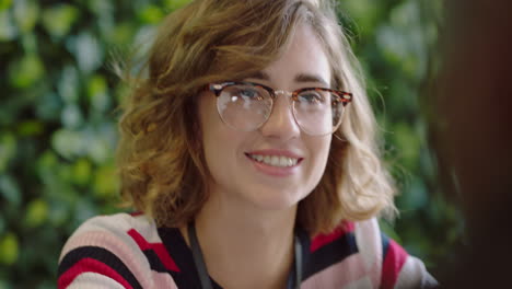 close-up-beautiful-caucasian-woman-student-discussing-ideas-enjoying-conversation-with-african-american-man-colleague-sharing-social-connection-in-trendy-startup-office