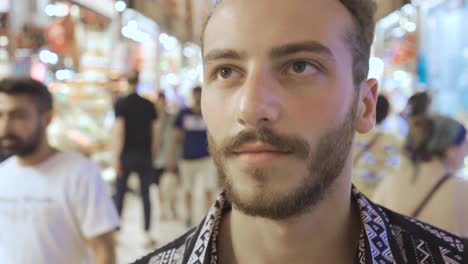 young man walking in the historical covered market.