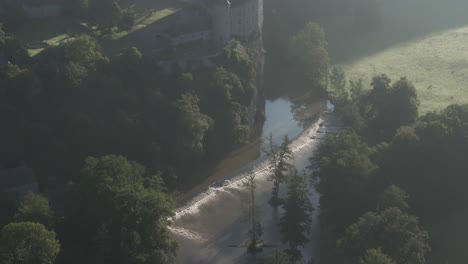 Flying-backwards-at-Chateau-de-walzin-at-Dinant-Belgium,-aerial