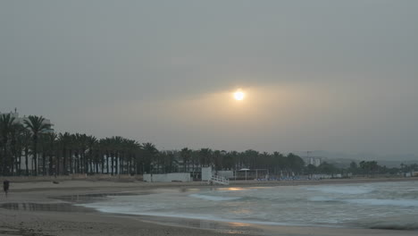 enjoy timelapse capturing misty morning scene as sun shines through clouds at seaside