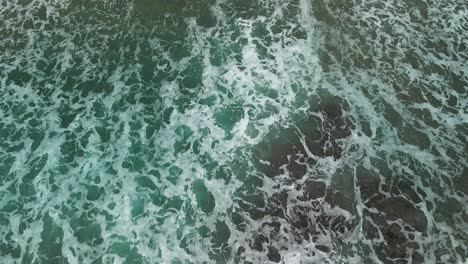 Tide-washing-out-with-aerial-view-of-sand