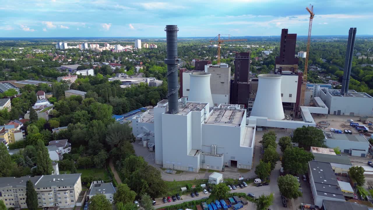 2 crane dismantling a power plant during a demolition process. Fabulous aerial view flight speed ramp hyper motion time lapse very close passing flight drone