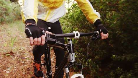 male mountain biker riding in the forest