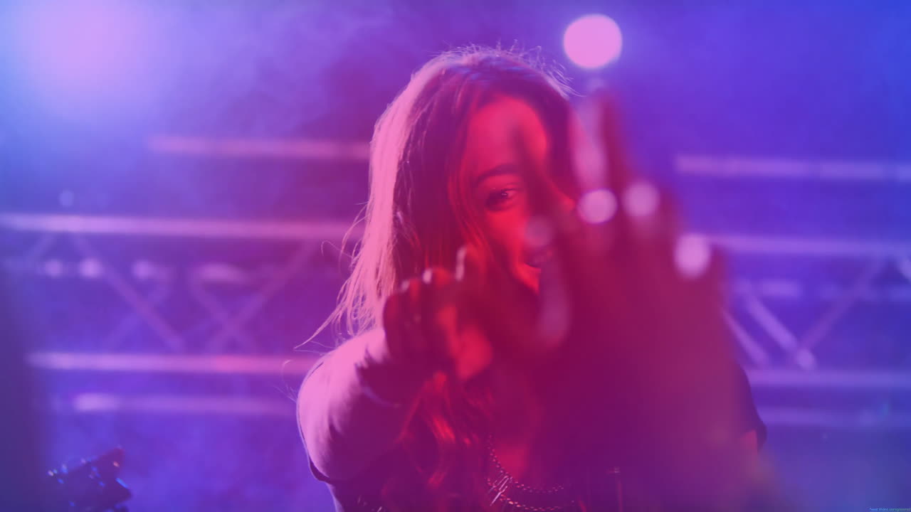 Female singer performing on concert stage showing animated music notes and light bars for branding