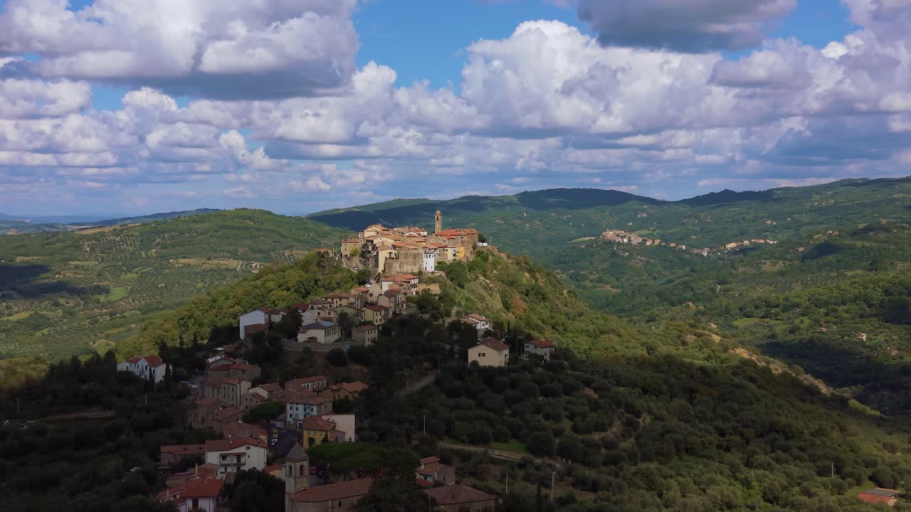 Montegiovi hilltop village in Tuscany, italy seen from above with stone rooftops and wide valley view