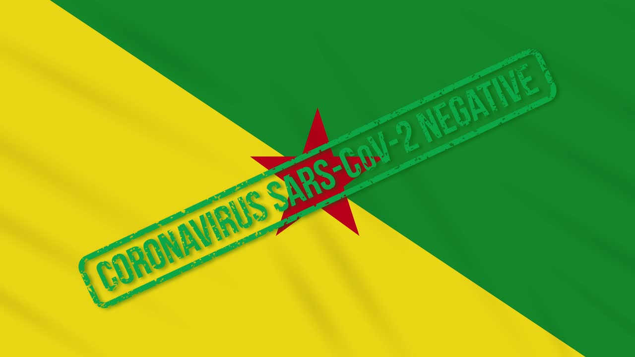 프랑스 기아나 (french guiana) 는 코로나 바이러스로부터의 자유의 녹색 스프를 가진 발을 흔들고 있습니다.