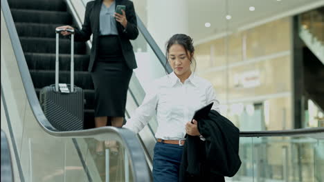 Business-women,-escalator-and-travel-with-luggage