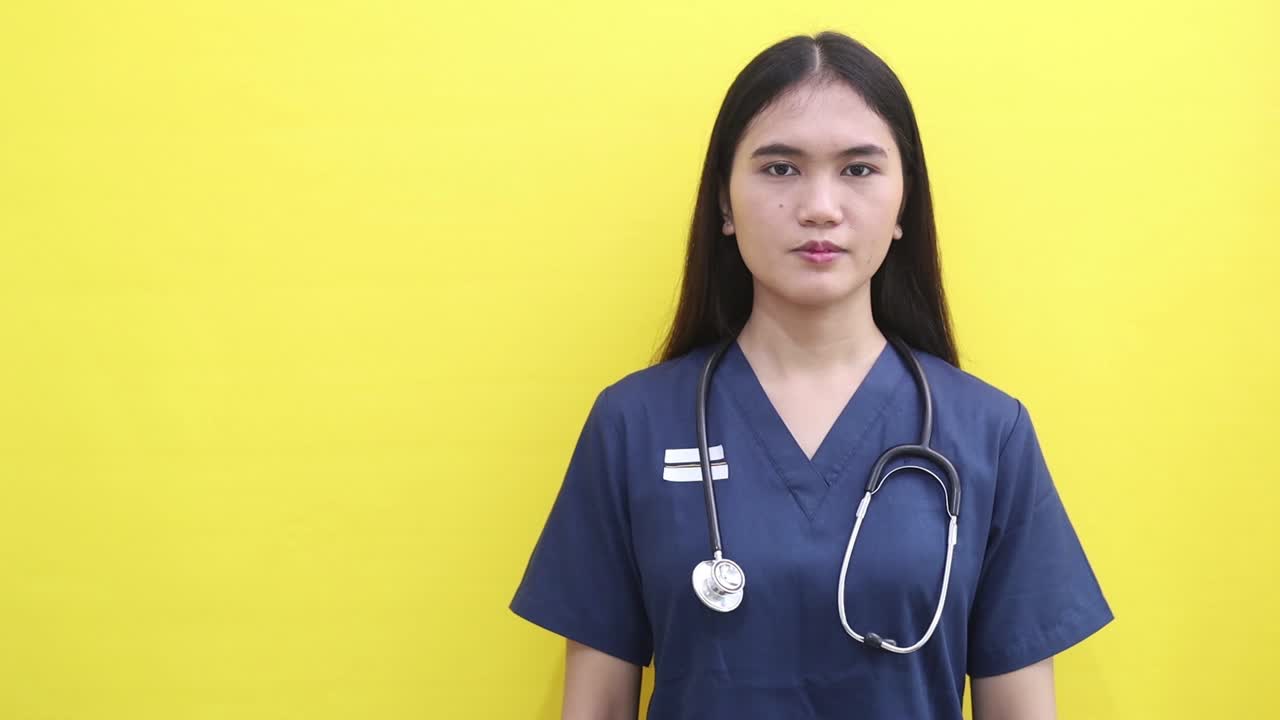 Happy Female Doctor or Nurse Pointing and Gesturing