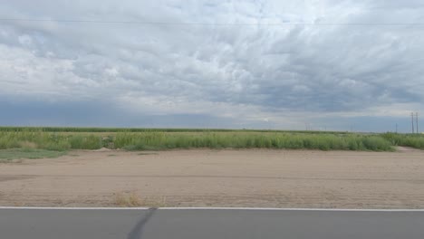 america out of the window of my truck - fields and farms fly on by