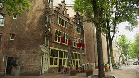 de silveren spiegel, a dutch restaurant in amsterdam, the netherlands with step-gabled red brick townhouse style exterior - slow panning shot