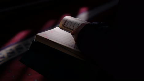 reading the quran in a sunny mosque