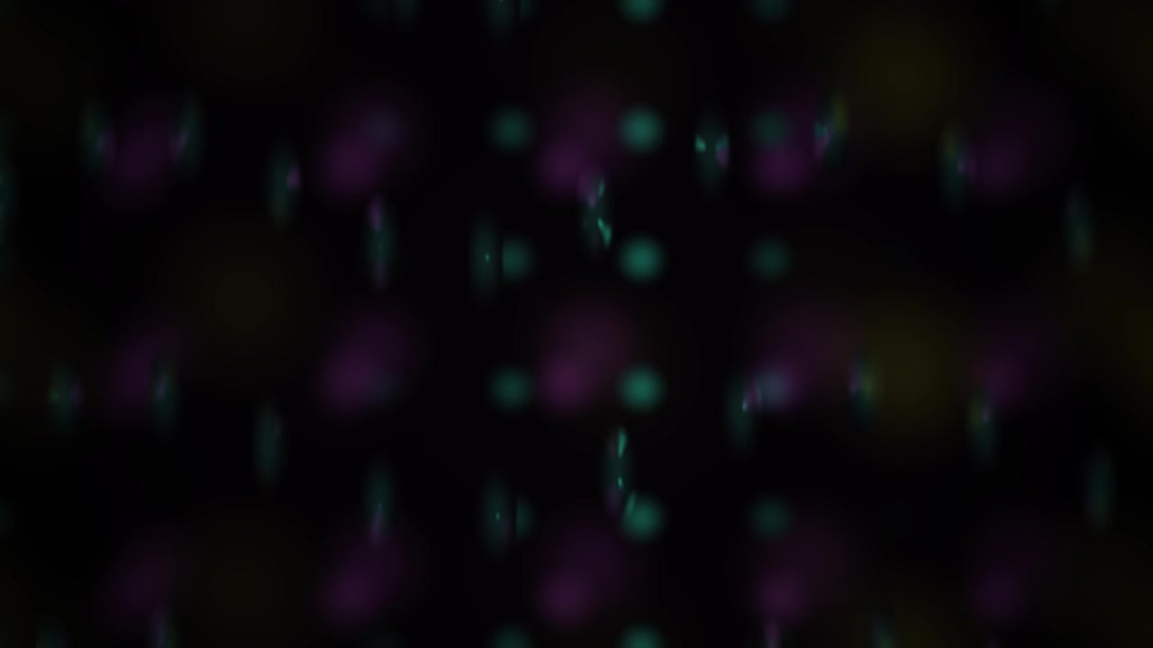 Abstract Background with Floating Purple and Yellow Bokeh Orbs