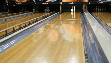 bowling alley lanes with bowling ball and pins