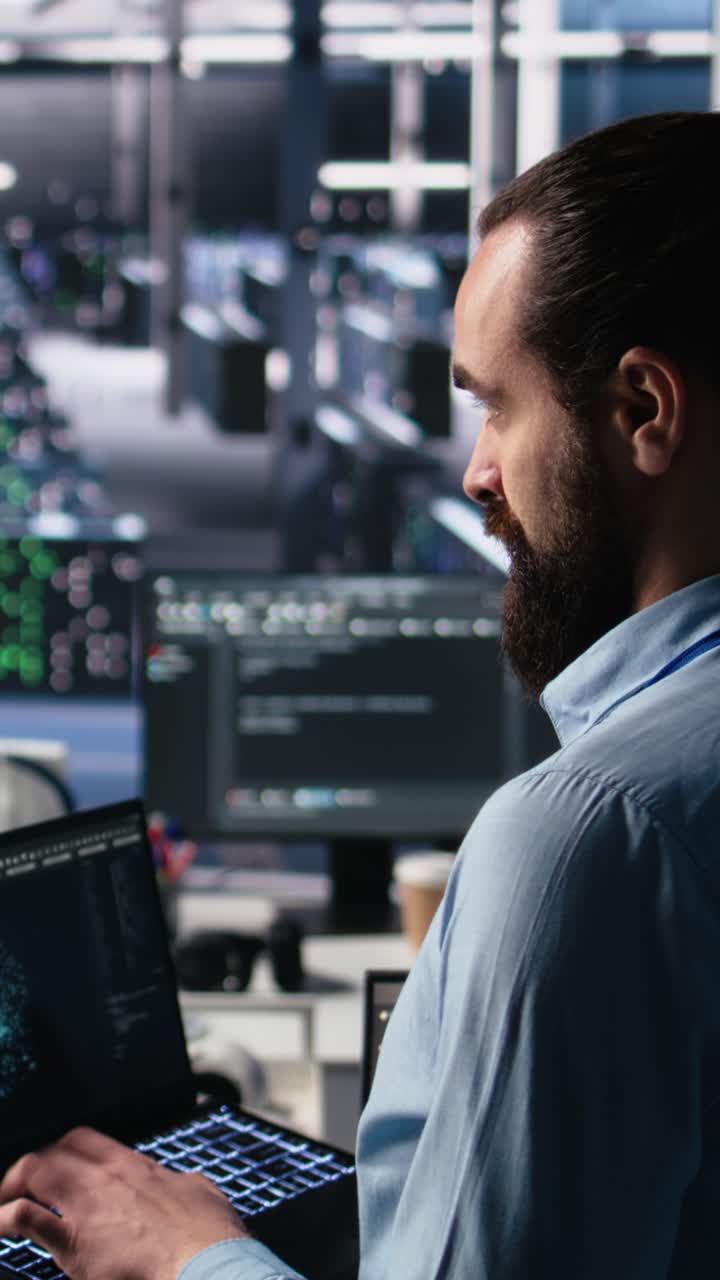 Vertical video Server room technician using AI LLM chatbot to review infrastructure diagnostics