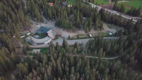 forward aerial shot over a campsite in the alps