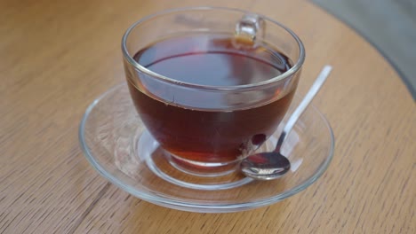 a cup of tea on a wooden table