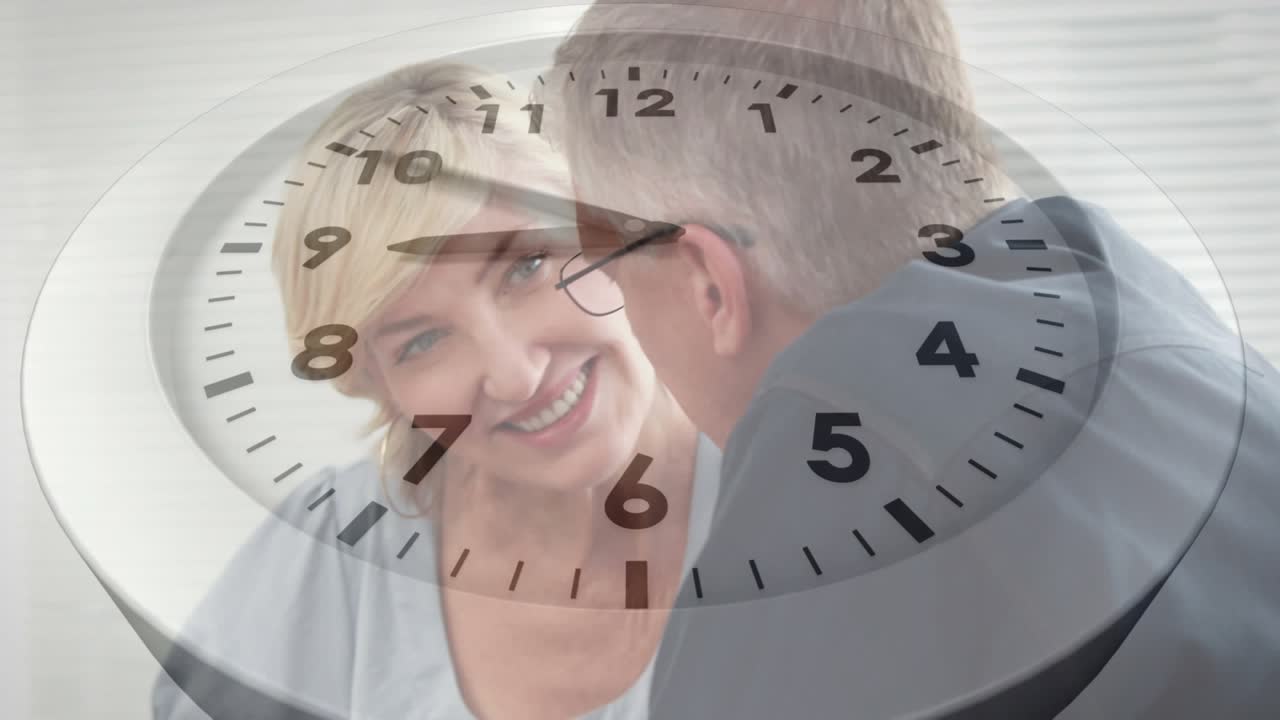 Animation of clock ticking over diverse business people using laptop in office